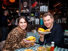 Host Sophie Flay and Bobby Flay sample the Classic Cheeseburger and Cottage Fried Potatoes at JP Melon's, as seen on Flay vs Flay, Season 1.