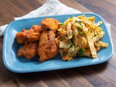 Shake up your fried chicken game with this Korean-inspired batter and slaw. Vodka and cornstarch in the batter are the secret to light and crispy skin, and kimchi and gochujang add a new kick to a traditional cabbage slaw.