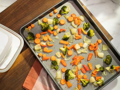 Katie Lee preps Roasted Veggies for the week on a sheet tray, as seen on Food Network's The Kitchen 