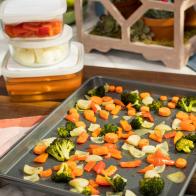 Katie Lee preps Roasted Veggies for the week on a sheet tray, as seen on Food Network's The Kitchen 