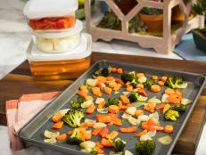 Katie Lee preps Roasted Veggies for the week on a sheet tray, as seen on Food Network's The Kitchen 