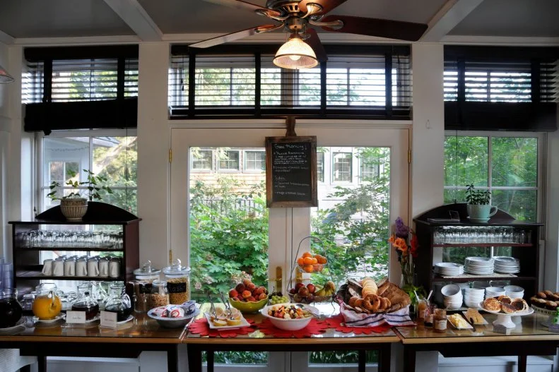 Buttermilk Falls Inn & Spa in New York's Hudson Valley could easily lay claim to being one of the most scenic â   and delicious â   bed-and-breakfasts on the East Coast. It's located on 75 acres on a bluff overlooking the Hudson River, and each of the inn rooms offers views of the river or the lush grounds. It also has its own 40-acre farm, Millstone Farm, which supplies ingredients for the inn's restaurant, Henry's at the Farm, as well as honey and herbs for some of the spa's signature treatments. If you want to get hands-on, you can even request to collect eggs for your omelet, one of the cooked-to-order menu items that supplement the inn's wonderful breakfast spread of yogurt, fruit, cereal, and breads and pastries from nearby bakery Frida's, served daily in the main inn's sunlight-flooded Sun Room. It'll fuel you for a day of exploring the Hudson Valley â   the Culinary Institute of America is 20 minutes away, and there are scores of farms that offer you-pick-it-programs and tours, as well as local wineries, breweries and distilleries. Return for dinner at Henry's, where chef and longtime Hudson Valley resident Peter Graziano draws from the bounty of the area. On the menu, a picture of a llama, the inn's mascot who can be seen roaming the property, denotes dishes prepared with ingredients grown on-site. Though the menu is hyperseasonal, popular mainstays include the smoked trout latkes, the duck breast salad and the chef's daily burger.