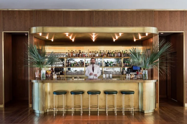 Housed in a restored 1960s building in downtown Charleston, The Dewberry echoes the Queen City's historic charm and mid-century architectural style. But it has also taken cues from the city's reputation as a modern foodie destination that's all about the details. The Living Room bar is modeled on a Charlestonian living room, with a showstopping brass bar, a curated library and a menu of morning coffee, afternoon cocktails and evening aperitifs. The go-to cocktail here is the Dewberry Old-Fashioned, a classic drink that's all dressed up — the ice cube is hand-chipped to fit inside the glass, then pressed with a custom brass stamp to embellish it with the hotel's logo and garnished with a skewered cherry that doubles as a stirrer, allowing guests to dilute and chill to their preference. For a cocktail with a view, head to the eighth-floor rooftop terrace. Here, hotel guests have exclusive access to the Citrus Club, which serves citrus-inspired tipples and light bites in whimsical surrounds. If you're looking for more sustenance, grab a table in the mahogany-paneled dining room of Henrietta's, which melds a French brasserie spirit with low-country cuisine and Southern hospitality. Walk off your dinner with a stroll down King Street or through nearby Marion Square, where you'll find the farmers market every Saturday (April to November) and brick walkways lined with local food artisans and food trucks.