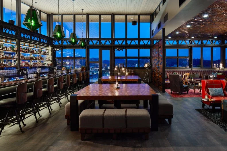 Located in Chattanooga's Bluff View Arts District, The Edwin is a stylish boutique hotel befitting its environs. The mix of clean, contemporary design, mid-century lighting and vintage touches that accentuate each room is reflected in the hotel's signature restaurant, Whitebird, and rooftop bar, Whiskey Thief. Executive Chef Kevin Korman pays homage to the region with a modern take on Appalachian and southern American cuisine at Whitebird. For a breakfast of champions, opt for the fried chicken and waffle sliders with smoky sorghum butter, deviled egg tartine or sweet potato doughnuts. At dinner, don't miss the signature dish, the Whitebird, a family-style dinner for two featuring a whole Poulet Rouge chicken, wild mushroom fricassee and two sides, such as bourbon-soy-spiked collard greens or mac and cheese. If the timing is right, don't miss Chef Korman's Chef's Table dinner series, where he plates each of the 10 courses in front of the guests. Grab a nightcap with a view of the Tennessee River at Whiskey Thief, the hotel's rooftop bar, which boasts over 120 bottles of whiskey alongside craft cocktails and local suds. Before you head out for a day of exploring, stop by the hotel's general store, Provisions, for a cup of Goodman's Coffee or kombucha from Muse and Metta, paired with baked goods from Niedlov's Breadworks. Confections from The Hot Chocolatier and hot sauce from Hoff Sauce make fine foodie souvenirs.
