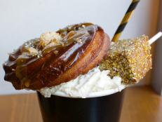 You won't find your typical Mexican hot chocolate at this walk-up window — although a bit of abuelita Mexican hot chocolate mix with spices is added in. This version takes it to a whole new level by adding a chocolate pumpkin churro, cookie crisp cereal and a dusting of gold stardust glitter and finishing it with a giant gold marshmallow.