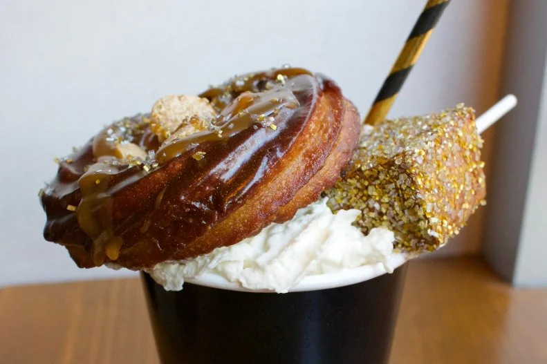 You won't find your typical Mexican hot chocolate at this walk-up window — although a bit of abuelita Mexican hot chocolate mix with spices is added in. This version takes it to a whole new level by adding a chocolate pumpkin churro, cookie crisp cereal and a dusting of gold stardust glitter and finishing it with a giant gold marshmallow.