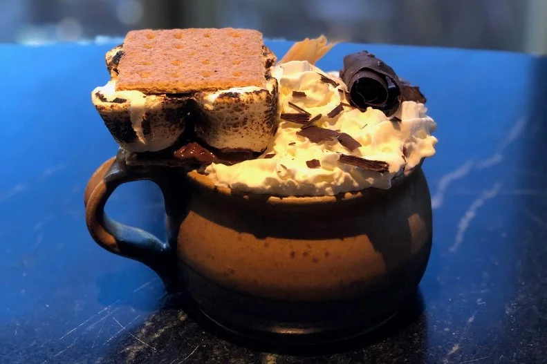 This boozy hot chocolate is so smooth that it's almost like butter. The combination of melted Valrhona Chocolate Guanaja, a splash of cream, Benjamin Prichard's Sweet Lucy Bourbon Cream Liqueur and peanut butter-infused Knob Creek Bourbon is melded together for 24 hours before being topped with chocolate shavings, whipped cream and a full s'more and served to the masses.