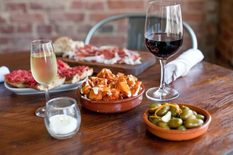 You can't go wrong at any of Durham restaurateur Matt Kelly's restaurants (head to Mother & Sons for a plate of hand-rolled pasta, to Lucky's Delicatessen for the ultimate remedy to a sad desk lunch, or St. James Seafood for pristine shellfish and expertly prepared local catch), but Mateo Bar de Tapas is the crown jewel in the Kelly empire. The very nature of a tapas restaurant and the made-for-sharing small plates make it convivial, but Mateo's atmosphere — at once buzzing and intimate, cool yet inviting — makes it the kind of place you'd pick for any number of occasions, such as date night, girls' night out, impressing out-of-town guests or entertaining your in-laws. The menu offers classic Spanish tapas such as patatas bravas and pan con tomate, alongside traditional dishes imbued with Southern flair, such as almejas pequenas, in which littleneck clams are served with sherry, garlic, boiled peanuts and ham, or albondigas, where pork-cheek meatballs are paired with saffron rice grits. Wash them down with a cocktail, like The State Bird, a gin and tonic made with Durham Distillery Navy-strength gin and saffron-infused tonic, or one of the sherries from the extensive list. This spot is perpetually packed, so it's best to make a reservation.
