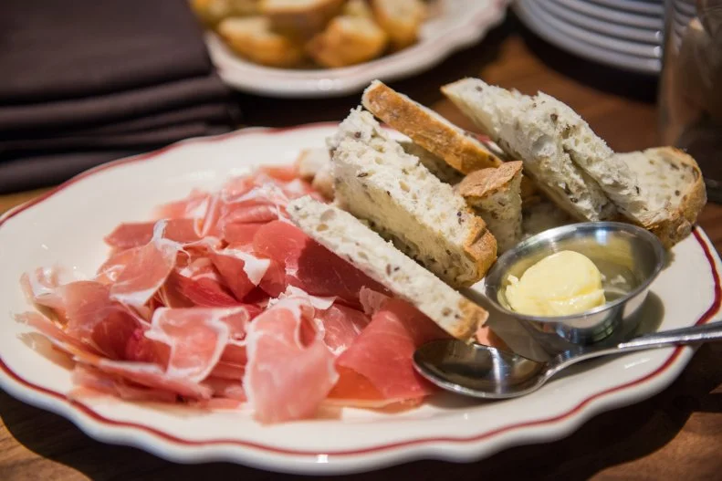 If there isn't time to head to Chicago's bustling Fulton Market district to taste the food from the original restaurant, The Publican, and nearby restaurant and butcher shop Publican Quality Meats, this airport locale will do the trick. Taking highlights from both menus, it features the same seasonal, flavor-packed, expertly sourced ingredients as well as signature dishes like the Spicy Pork Rinds and the Farm Chicken.