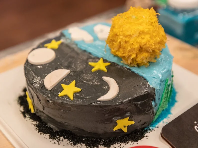 Contestants Karthik Vemparala and Meadow Roberts' completed dish Chocolate Cake w/ Cinnamon Pastry Cream and Maple Buttercream and Vanilla Cake Brushed w/ Apple Soak, Apple Buttercream filling, Maple Buttercream, and Rice Cereal Treat Sun, as seen on Kids Baking Championship, Season 6.