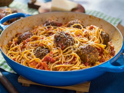 Geoffrey Zakarian makes Oven-Roasted Tomato Sauce and Jeff Mauro makes Magic No-Bread Meatballs, as seen on Food Network's The Kitchen, Season 20.