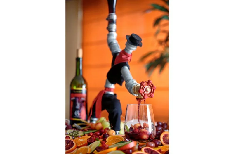 Tired of seeing sangria served in buckets, Barton G. Weiss of Barton G. looked for a way to tie the drink back to its Spanish origins and settled on a matador. The housemade beverage â   a blend of red wine with fresh local grapes, apples, citrus, and fresh and dried cranberries â   comes streaming out of a figure constructed from pipes and dressed up to resemble a bullfighter.