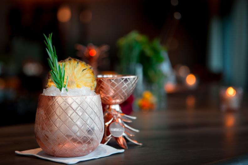 The pineapple was once a symbol of hospitality, used by colonial innkeepers to signal that rooms were available. At the Matador Room, the pineapple beckons with another message: upscale food and drinks by Chef Jean-Georges Vongerichten. Copper pineapples custom made by Absolut hold a cocktail as luxurious as the vessel: the vodka maker's Elyx is mixed with salted caramel and rosemary syrups, and dehydrated pineapples that perfume the cocktail with the fruit.