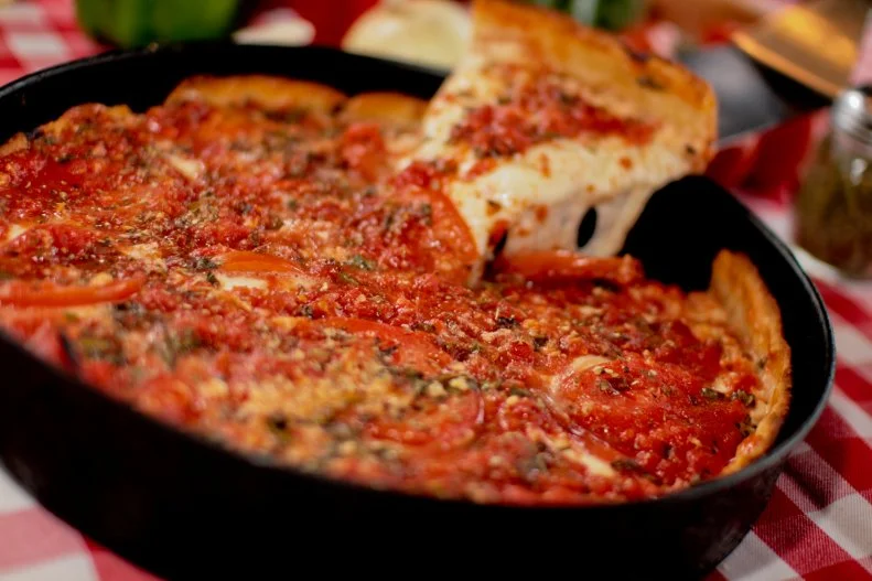 The original father of Chicago deep-dish pizza was Rudy Malnati Sr. of Pizzeria Uno. It turns out the apple indeed doesn't fall too far from the tree, as his son Rudy Jr., who owns this burgeoning local franchise, puts out the ideal modern version of the deep-dish form. The key here is a buttery, crisp crust that provides enough depth for the pies to qualify as deep dish but isn't so thick that it overwhelms the cheese and other ingredients.
