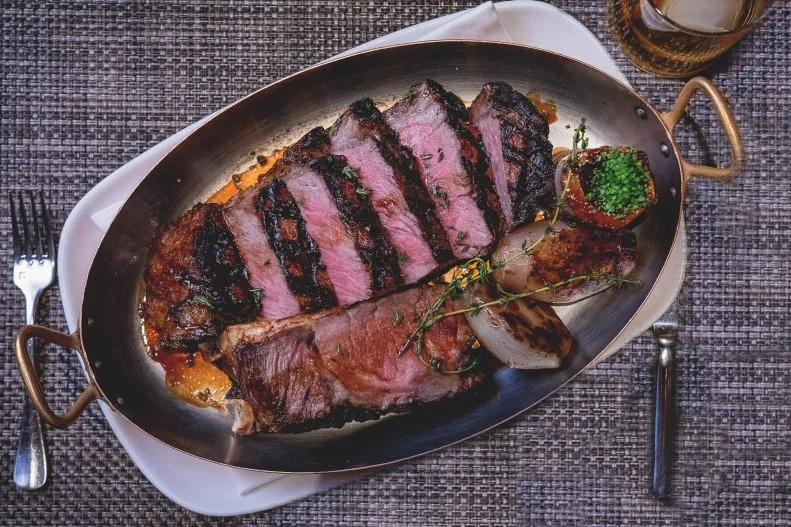 Most people know Tom Colicchio from Top Chef, but he's much more than just a TV judge. He's the brain behind a restaurant empire that includes Craft, Riverpark and more, and his Nevada steakhouse Craftsteak is one of the best places within view of the Vegas strip to order ... a strip steak. Both American and Japanese wagyu are offered here, but you can't go wrong with the dry-aged 22-ounce T-bone from Double R Ranch in Washington state.