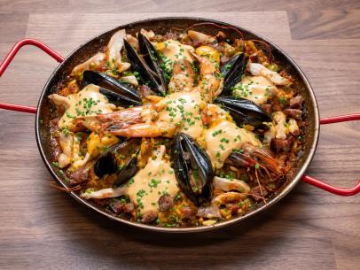 Host Anne Burrell's dish is Chicken, Shrimp, and Mussels Paella during the Main Dish Challenge, Paella, as seen on Worst Cooks in America, Season 16.