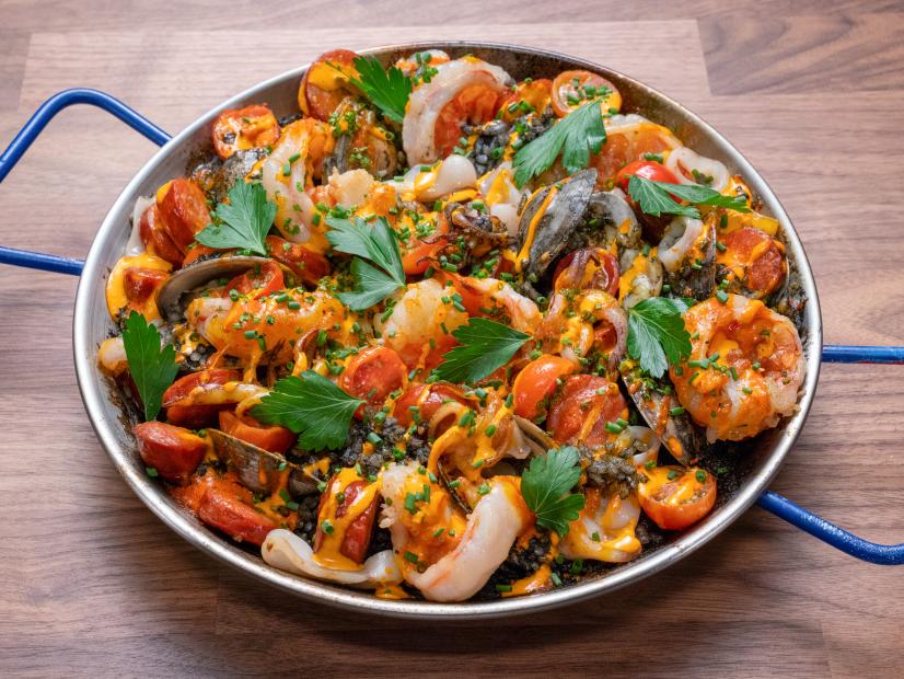 Host Tyler Florence's dish is Seafood Paella with Orange Aioli during the Main Dish Challenge, Paella, as seen on Worst Cooks in America, Season 16.