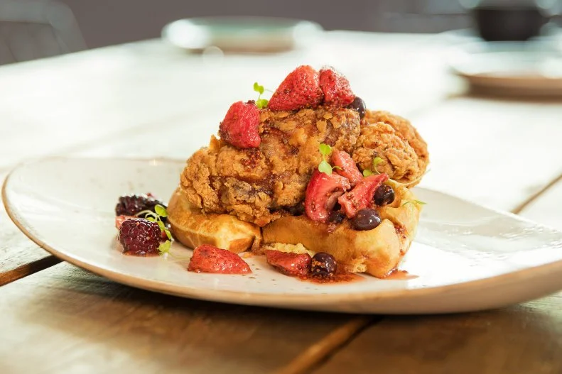 The Southern influence isn’t as strong here as in the rest of Florida, but it definitely exists, and many of the restaurants in town nod to Southern flavors with chicken and waffles. In order to really stand out, though, chefs need to figure their twist on the dish. Social Club at the Surfcomber has two: First, the kitchen cooks the bird sous vide for four hours before bathing it in buttermilk, flour-dredging the bird and deep-frying it. As for the waffles, they’re cinnamon instead of ordinary buttermilk, and the syrup is maple-berry-mustard, further playing up the sweet-spicy-savory triumvirate.