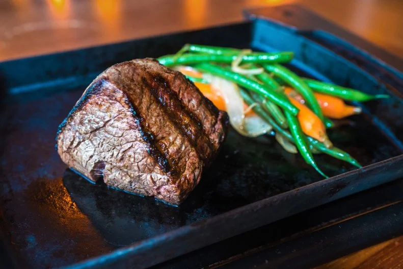 When people from South America want a superior steak experience, they look to the Argentines. Even when they’re not working with beef from Argentina, Argentinian steakhouses still differentiate themselves from others because of the level of care they put into sourcing, and also the simplicity with which they prepare the meat. Letting the meat shine without a need for butter soaks or overpowering sauces. Att popular Brickell steakhouse PM Buenos Aires meat is the focus, minimally seasoned with only Argentinian grilling salt, and grilled over charcoal to give a distinctive flavor. A small dish of garlicky, herbaceous chimichurri arrives on the side, but you don’t need to use it on the steak — it goes just as well with bread or a salad.