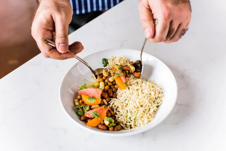 Tailor started as a wildly popular pop-up dinner party called VEA Supper Club, which was hosted at various restaurants and venues around Nashville. Now in a permanent location with just 40 seats, founder and chef Vivek Surti has crafted an ambiance that matches the original intent — you feel like you’re eating great, home-cooked, South Asian American dishes inside a friend’s stylish home. A set menu of eight courses is served during two seatings, Thursday through Sunday nights. The menu leads from light snacks like dhokla with mustard seed, coconut, and sesame to salads, a fish and meat course that might include local trout or lamb with chiles and mint, to a rice, then desserts. Along the way, Surti puts a personal touch on the experience, sharing anecdotes and stories behind each dish.