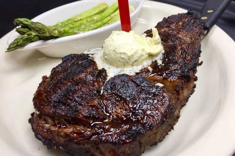 Mike Cole (Big Mike) had a dream. He wanted to open steakhouses in rural towns, so that residents wouldn’t have to drive hours in search of great steak. To make that happen, he paired up with friends Scott Powell and Caine Conway to debut a casual chophouse in Thomasville, Alabama. The perfectly cooked crunchy crusts and juicy interiors of Cole’s 28-day-aged, hand-cut steaks are so good, the team now has an additional two locations. All of the steaks are seasoned with a special seven-spice blend, wood-fired and topped with a garlic-herb butter. It’s hard to go wrong with any pick, but the $34 Big Mike, a 24-ounce ribeye served with salad, bread and choice of potato, has been called one of the best steaks in the state.