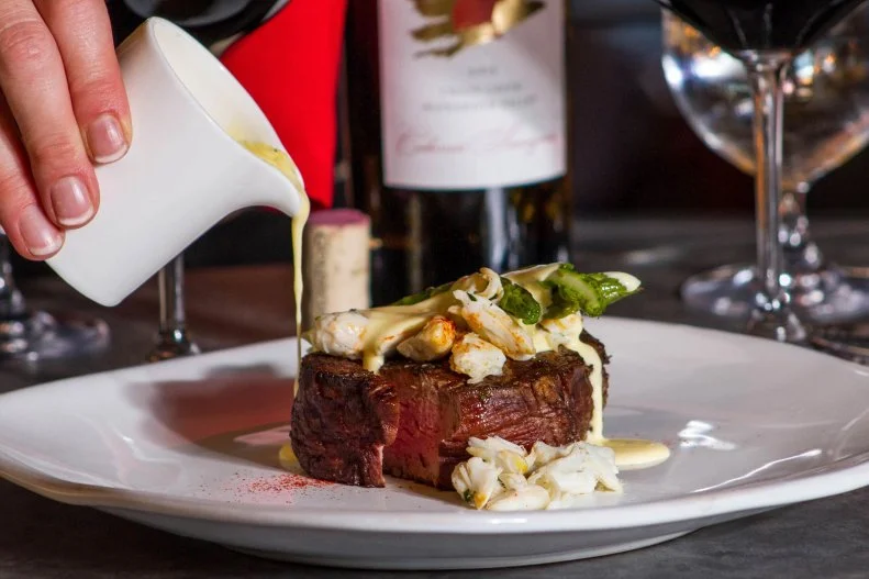 Delmonico Grill serves the best ingredients available from local Black Hills farmers and ranchers including wet- and dry-aged steaks in preparations like a ribeye with an espresso rub crust, and classic crab-topped Steak Oscar. Though beef is the specialty, other dishes include seared orange-miso salmon and the “constantly-inspired” foie gras of the moment, all ideally paired with a California-centric wine list.