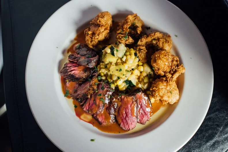 In New Orleans, the Brennan family is considered restaurant royalty, saluted for reflecting and impacting the city’s world-famous cuisine. The meat-focused menu at this beloved French Quarter meat destination follows the family tradition of highlighting local flavors in regional starters like country gumbo, turtle soup and barbecue shrimp. That local focus extends to the steak, too. The roasted prime rib features a Creole glaze, USDA Prime strip is creole seasoned and cooked in a cast iron skillet, and the house filet is topped with flash-fried oysters and creamy béarnaise. As one would expect in a NOLA mainstay, the fare is paired with expertly prepared sazeracs and other classic cocktails.