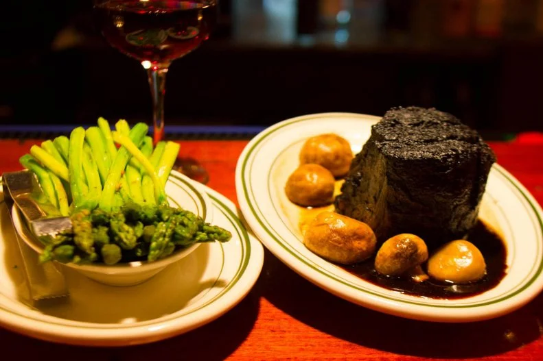 This old-school supper club is like walking into a time warp, back to the days when a night on the town often included a nice steak dinner. The Milwaukee icon has served slow-roasted prime rib, hulking porterhouses and other steakhouse classics in its wood-lined dining room since 1946. Not much has changed over the decades — Five O’Clock still serves high-quality USDA Choice meats, noteworthy wines and mid-century-cool cocktails including martinis and sloe gin fizzes in a space that feels like a favorite for stars of yesteryear. It even has an upstairs piano bar called the Alley Cat Lounge, where diners sip nightcaps while watching free after dinner shows.