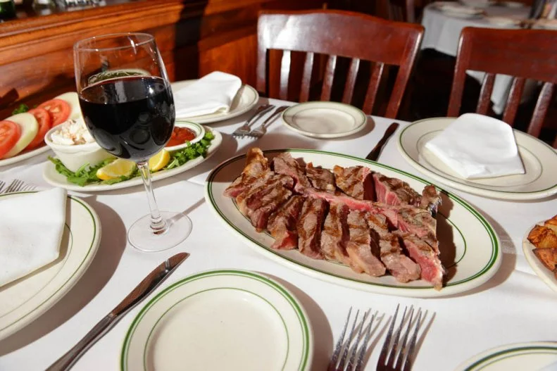 With experience at Joe Byer’s Wine Cellars in Detroit, the Helmsley Palace in Manhattan, and 15 years at Peter Luger’s in Brooklyn, Joseph Kustra knows steaks. He brought that fine dining experience to Connecticut when he opened his namesake steakhouse in 2000. The white-tablecloth place is hailed for its USDA Prime dry-aged beef (the porterhouse is a favorite) cooked to guest’s specifications and sliced, so it’s easy to eat. Make sure to start with the bacon appetizer, an inch-thick slab that’s grilled to order and can throw down with the best pork belly in any town.