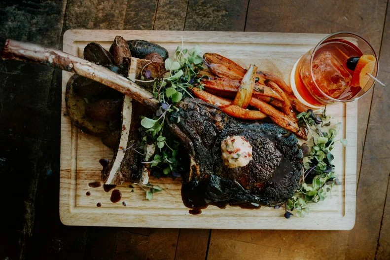 You don’t have to look far to find a great steak in Big Sky Country. There are a whole lot of cows in Montana — cattle far outnumbers human residents in the state. Open Range in Bozeman offers steakhouse-style cuts without any pretense. The airy restaurant is hip, with exposed beams and ducts, and industrial-inspired Edison bulbs. Prime beef, cut in-house, is seared to order in cast-iron skillets served with seasonal vegetables and Bordelaise sauce. One of the highlights is the South American-inspired asado for two, a platter of ribeye, duck leg, house-made sausages, fingerling potatoes and chimichurri with salad and fresh bread.