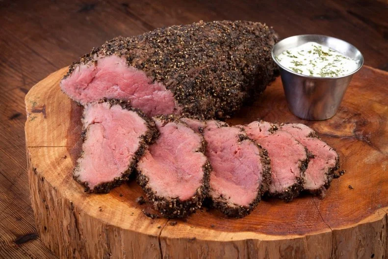 Texans’ love of smoke runs deep: the state is known as one of the best barbecue regions in the country. The best, according to Texans themselves. The same local mesquite that is used to flavor its famous brisket is used to season the excellent steaks served at Perini Ranch just outside Abilene. Deemed one of America’s Classics by the James Beard Foundation, the restaurant has served certified Angus ribeyes, strips and filets since cowboy cook and rancher Tom Perini decided to transform his hay barn into a restaurant in 1983. Those smoky meats are paired alongside Lone Star State-inspired sides, like green chile hominy and old-fashioned green beans.