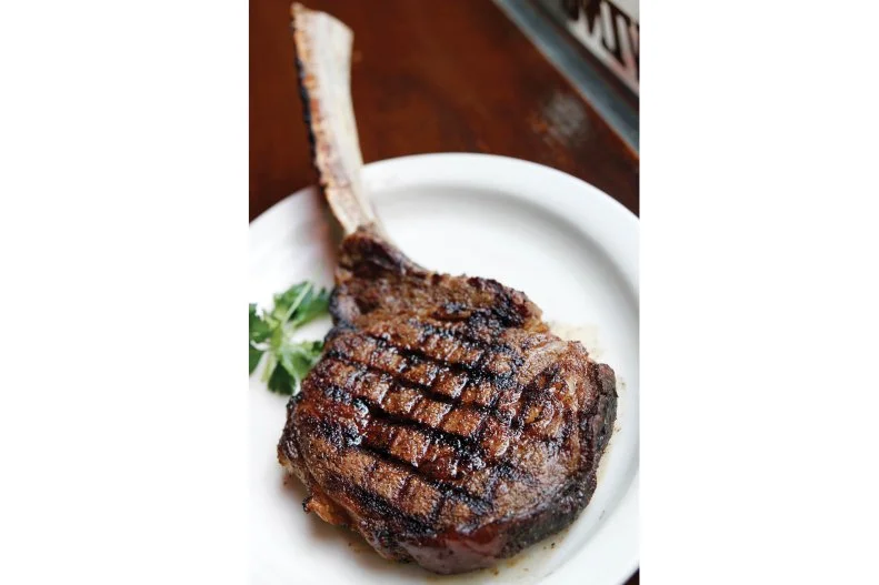 This temple of meat has been an Indianapolis staple since 1902. It’s the city’s oldest steakhouse in its original location and it’s so legendary local lure claims that its beloved horseradish-heavy shrimp cocktail helped Indy win its bid for the 2012 Super Bowl. St Elmo’s steaks certainly didn’t hurt either. The place was recognized as one of “America’s Classics” by the James Beard Foundation for its excellent versions of traditional dishes likes it's perfectly charred ribeye and bone-in filet. All the chops, chickens and cuts are served in the old school way with choice of navy bean soup or tomato juice and pick of baked potato, fries, redskin mashed potatoes and sauteed green beans.