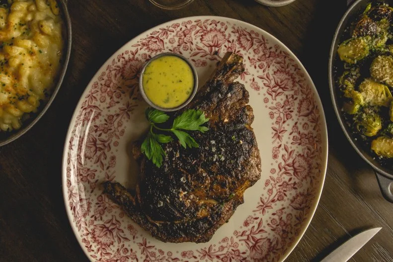 Few steakhouses bring the warmth and romance like Bavette’s, located on the casino level of Park MGM. Richly decorated and intensely intimate — like its Chicago counterpart — the mahogany space is moodily lit with soft yellow globe fixture, transporting diners to a nostalgic mid-century era. On the menu, there are steakhouse classics like shrimp cocktail, raw oysters and a generously dressed wedge topped with gorgonzola, but steaks are the main attraction. Dry-aged for 42 days, the 22-ounce bone-in ribeye is a hefty portion but can — and should — be made extra-hearty with the accompaniment of roasted bone marrow.