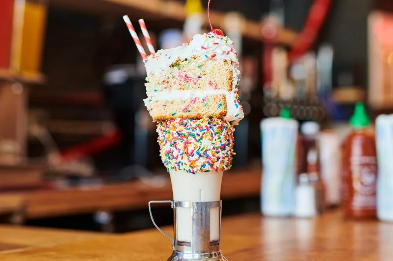 This casual burger bar in the Venetian has earned Insta-glory for its sky-high desserts, appropriately coined CrazyShakes, made riotously excessive and extravagant with toppings galore. Milkshakes in traditional and outlandish flavors arrive in old-fashioned glassware under fluffy clouds of whip, bright puffs of cotton candy and full-size slices of cake for garnishes.