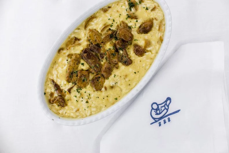 Harry’s Bar in Venice, Italy, is one of the world’s most-iconic culinary destinations, but Giuseppe Cipriani’s touch extends to cities around the world, including at Cipriani inside the Wynn. A mixed salad of artichoke and avocado is tented with two thick cuts of sliced Parmesan, and the legendary baked tagliolini with ham, appears under a layer of bubbly cheese with browned edges. Prepare for a cheese pull extraordinaire.