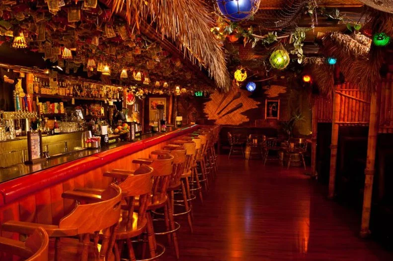 Michael Thanos and Martin Cate yearned for an era of tiki they couldn’t find in 2006, so they created it themselves. The result was Forbidden Island, a tiki bar of yesteryear – one that recreated the mythical Polynesian bars that were so popular in the 1950’s and 1960’s. All of the mood lighting and puffer fish, a free-play juke box with era-appropriate tiki soundtracks, and beloved cocktails like the hurricane and the large-format scorpion bowl. The juices are all fresh-squeezed and syrups house-made, of course.  Their mug program is huge, with well-known tiki designers creating highly sought-after limited-edition mugs.