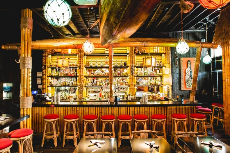 With plenty of shareable cocktails and classics with a twist, like the Adrift Old Fashioned with single-barrel rum, bourbon, espresso, coconut and angostura bitters, bar goers can relax while staring up at 70-year-old, hand-carved totems as a centerpiece of the bar. Don’t bypass the food — the South Broadway locale is known for their Polynesian fare as well, including guava barbecue baby back ribs, pu pu platers and spicy Hawaiian chile shrimp.