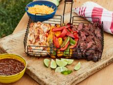 Love fajitas, but don't want to deal with multiple skillets and a smoky kitchen? Take it outside! These grill basket fajitas keep all the ingredients separate so everyone can have their favorite combinations without creating extra mess—plus the grill add a yummy char to everything.