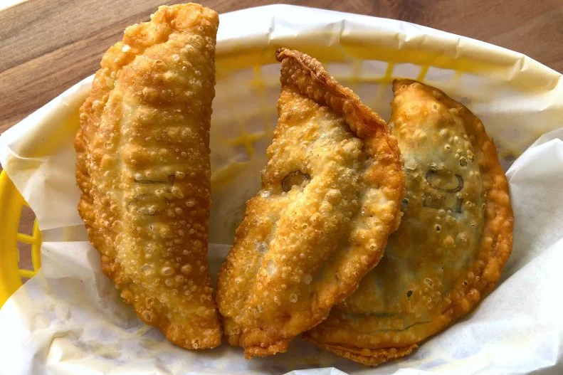 Just blocks from the ocean, Chalos is a bright and beachy cafe with over a dozen kinds of empanadas. At barely $4 each, these crisp Argentinian pastries practically demand a full sampling. Fillings include chicken, ham and cheese, three-cheese, and spinach and mushroom. Prepared to order and served hot, the classic “carne” with beef and hardboiled egg is highly recommended, as is the spinach and crema.