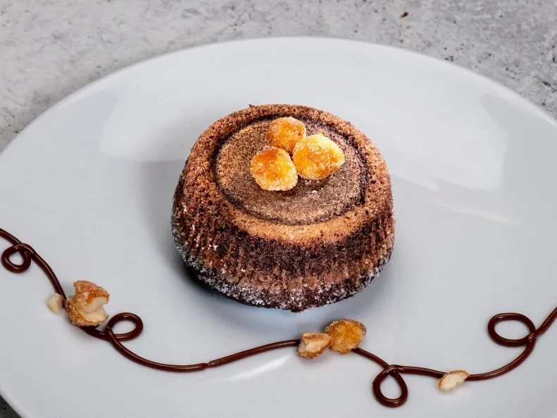 Contestant Joshua Livsey's dish is Chocolate hazelnut lava cake, during the Skills Challenge, as seen on Best Baker in America, Season 3.