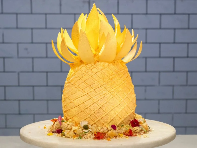 Contestant Michael Russ II's cake is White chocolate pineapple with a coconut sphere, poppy seed coconut sponge cake with coconut Makrut lime mousse and pineapple cilantro lime compote, during the Master Challenge, as seen on Best Baker in America, Season 3.
