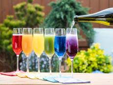 The Kitchen hosts create a rainbow of mimosas using different flavored juice bases, as seen on Food Network's The Kitchen