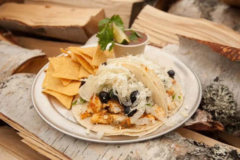 Prior to opening his taco and burrito truck, El Green-Go’s, Anchorage-based chef Tyler Howie worked at a healthy-focused restaurant that specialized in vegan options, and whenever he ran Spanish- or Latin-inflected vegan specials, they sold out. That combo inspired the truck’s menu, which offers inventive riffs on burritos and tacos for vegans and meat-lovers alike. Howie smokes all the proteins, a nod to his N.C. roots and barbecue pride, from tofu to local fish and game. Try the smoked-tofu-black-bean-burrito topped with coconut black queso or vegan nacho cheese, or the summer-ready fish tacos featuring smoked halibut topped with lightly pickled local blueberries with shaved fennel (pictured above). There are plans to add elk tacos with pickled blackberries next. Look for the truck at summer festivals and in downtown Anchorage at 4th and L Street.