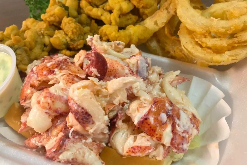 Since its founding in 2017, the Bangor-based Lobster Buoy has become a favorite among locals and visitors for its roster of regional seafood classics. The signature lobster roll comes in three sizes: the two-ounce Baby Buoy, a quarter-pound sandwich or a half-pound (as pictured), with freshly shucked lobster meat mixed with mayo and piled onto a buttery grilled bun, served plain or with hot drawn butter. Upgrade your roll to a basket and it’ll come with fresh-cut French fries and homemade coleslaw. Owners Benjamin Gregory and Erin Doughty round out their menu with additional Maine bounty, including fried whole belly clams, fish ‘n' chips, crab rolls and lobster stew. Pro tip: ask for the secret menu lobster melt, which melts sweet lobster meat into a gooey grilled cheese sandwich.