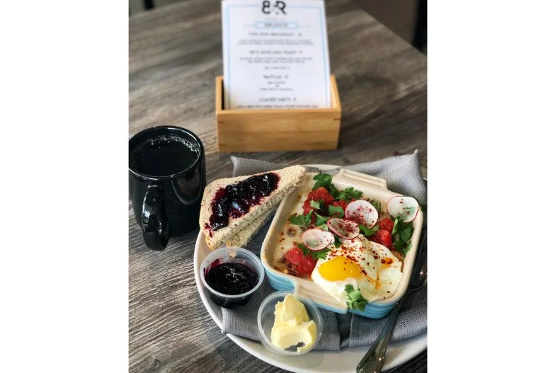 8th & Roast has been roasting and brewing coffee for Nashvillians for years on the south side of town; they recently added a second location on Charlotte Avenue where you can now find brunch every day from 7 a.m. until 2 p.m. To go alongside their selection of coffees roasted in-house, find a made-to-order list of dishes, like a bowl of loaded stone-ground grits mixed with stewed tomatoes, bacon, cheese and herbs. Or splurge on one of their hearty “Things on Toast,” like the avocado version topped with pickled red onion and fresh herbs, or the ham and eggs, which comes with a layering of sliced coppa, spring lettuces and a citrusy hit of Meyer lemon.