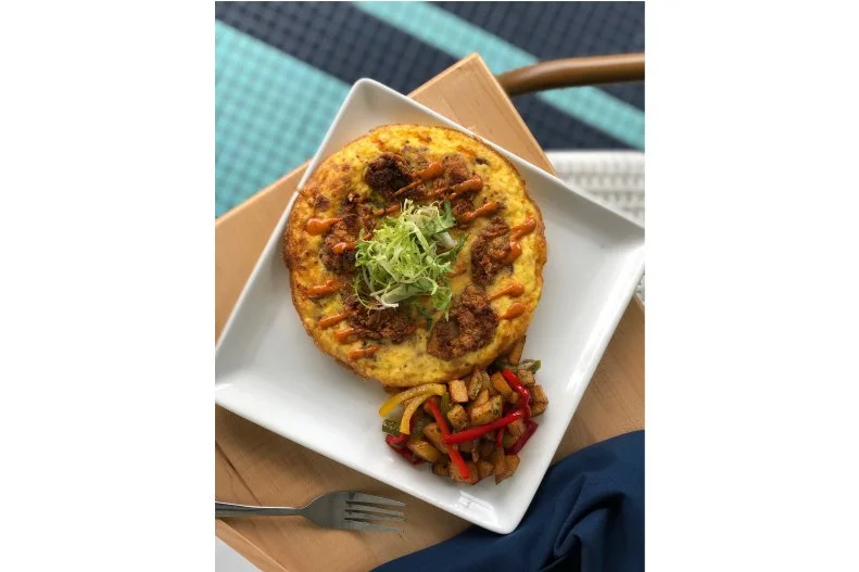 With hints of Creole and Gulf coast influence, the menu at Saltine is seafood-heavy and full of flavor and spice. Grab a seat inside the sprawling dining room where a modern nautical motif includes the long tentacles of an octopus painted along the walls. During brunch on Sundays from 11 a.m. to 2 p.m., you can start with a platter of raw oysters, most of which come from the Gulf, before tucking into entrees like a blue crab and asparagus scramble, which gets a ladle of hollandaise and a side of potatoes, or an omelet loaded with shrimp and avocado.