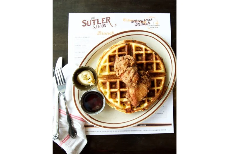 The Sutler Saloon smartly combines Nashville’s favorite meal with its favorite type of music during Bluegrass Brunch each Saturday and Sunday from 10 a.m. to 3 p.m. The saloon’s calling card is its menu of updated signature Southern classics. It’s packed with great choices like cheddar-scallion cornbread waffles served with buttermilk fried chicken and a cinnamon-bourbon syrup. The breakfast tacos are a stand out, as are the hash plates — go for the green chile chicken piled with potatoes, peppers, onions and a fried egg. For another taste of Nashville, order up the Whisper Creek coffee, enhanced with the locally made sipping cream spirit.