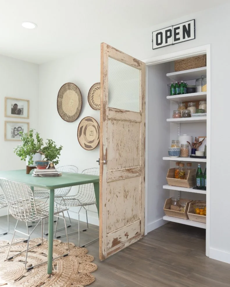 This pantry door is perfect for this space giving some warmth to the dining area, as seen on HGTV's Hidden Potential. 