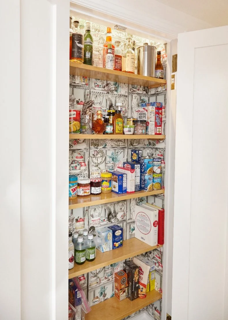 Whimsical wallpaper transforms this pantry from a practical space to a fun-filled one.