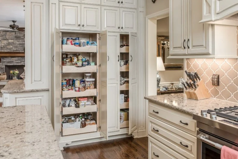The pantry was seamlessly integrated into the kitchen cabinets with matching doors. More cabinets could be stacked on top to maximize storage space.